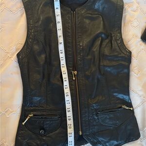 Sleek Black Leather Vest with Gold Details